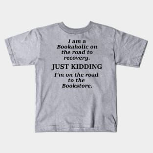 I am a bookaholic on the road to recovery just kidding I'm on the road to the book store Kids T-Shirt